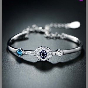 Silvertone evil eye with Swarovski crystals